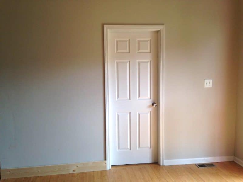 blank wall with a door