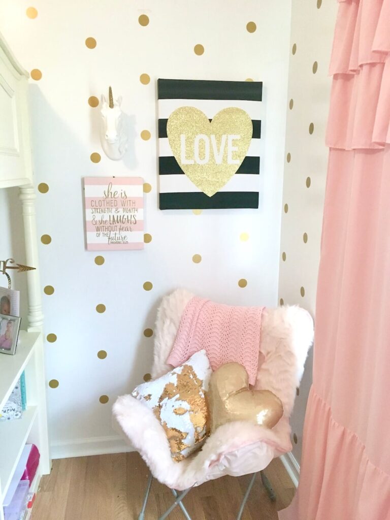 girls bedroom with polka dot wall decals in straight rows