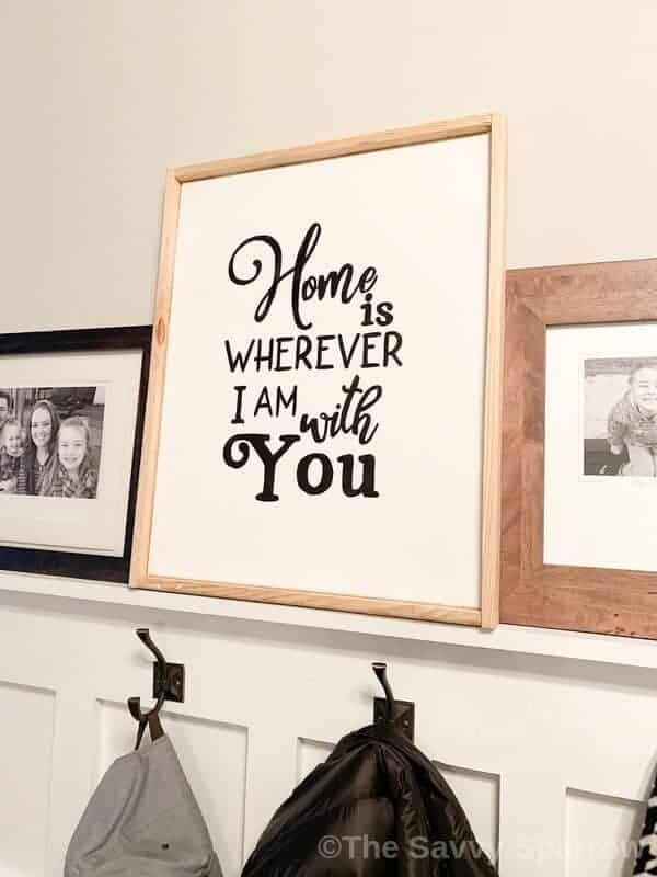 DIY sign on canvas with wood frame that says "Home is wherever I am with you"