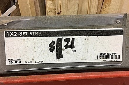 Home Depot shelf tag for 1"x2" boards with price of $1.21