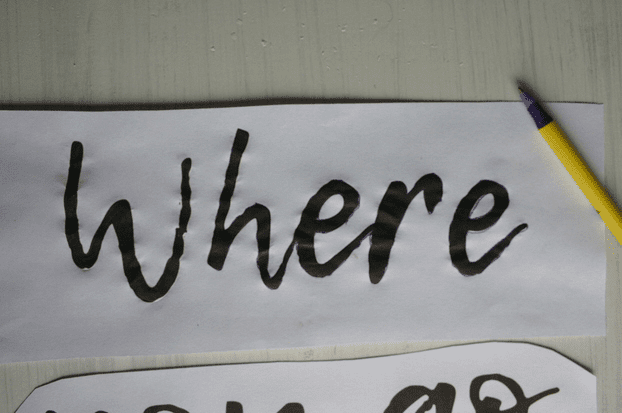 the word "where" printed on paper and outlined with a purple pen