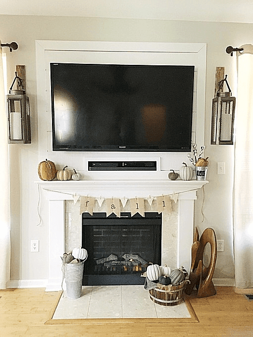 This easy DIY fall fireplace decor is the perfect way to decorate your house for fall if you like minimalistic style and you're on a budget!