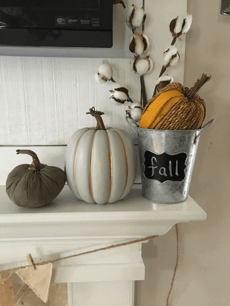 This easy DIY fall fireplace decor is the perfect way to decorate your house for fall if you like minimalistic style and you're on a budget!