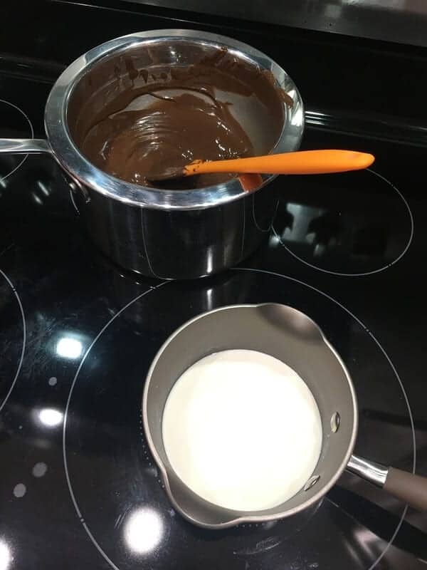 Homemade chocolate fondue with heavy cream