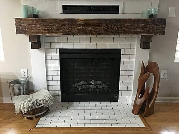 Want to know how to paint fireplace tile to look like subway tile? Try this tutorial to paint tile on your fireplace and transform it from boring builder grade tile to faux subway tile without a stencil!