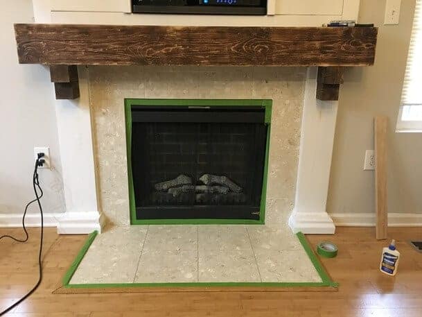 Want to know how to paint fireplace tile to look like subway tile?  Try this tutorial to paint tile on your fireplace and transform it from boring builder grade tile to faux subway tile without a stencil!