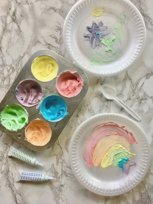 edible finger paint in muffin tins on a table