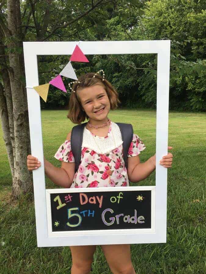 first day of school photo with DIY photo prop frame