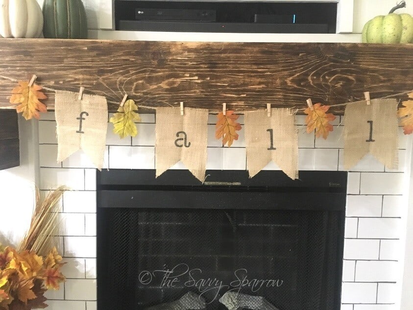 DIY burlap banner for fall hanging on a fireplace mantel