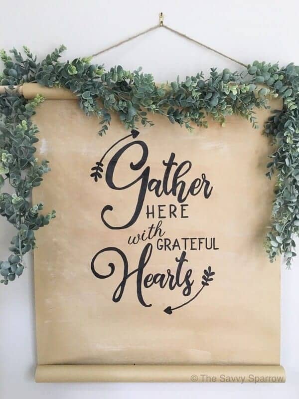 DIY scroll sign that says gather here with grateful hearts