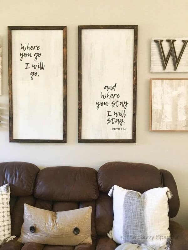 DIY wood signs hanging on a wall with other neutral art work