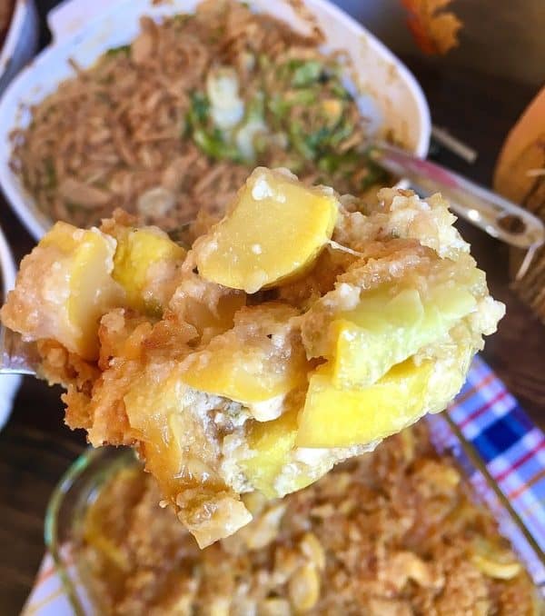 low carb squash casserole in a serving spoon