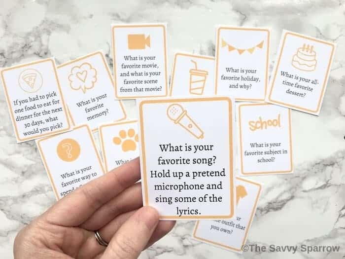 small cards with questions to ask kids printed on them