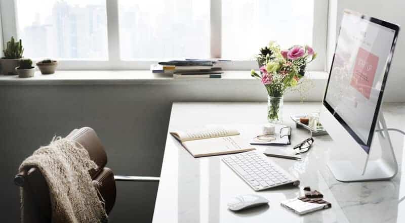 desk with computer and papers