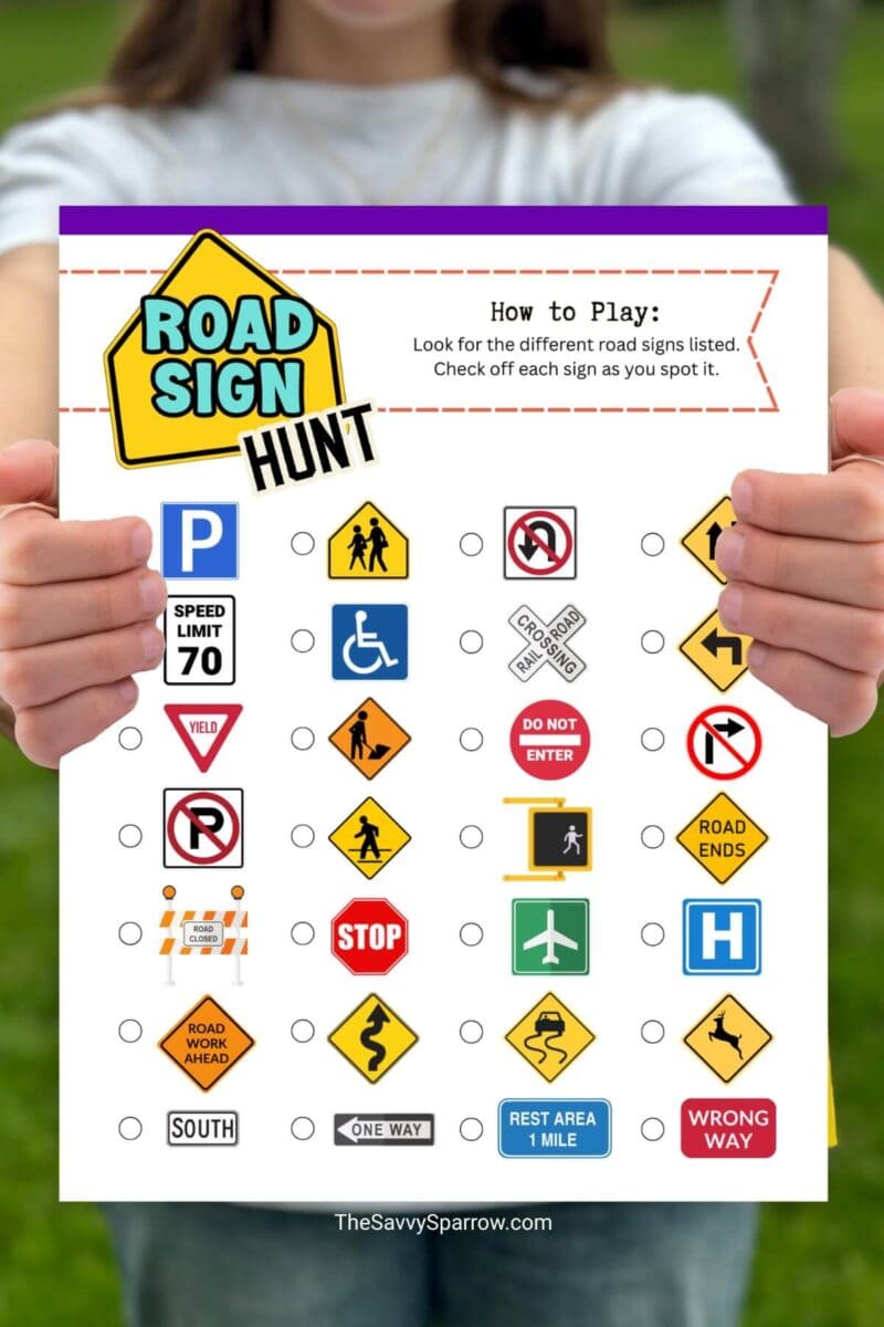 child holding up a road sign scavenger hunt activity sheet