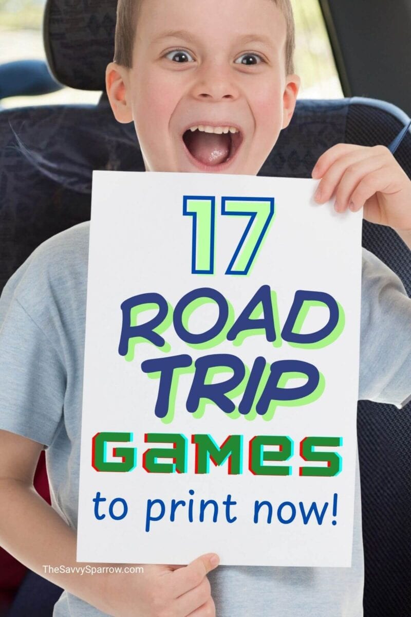 boy in the back seat of a car holding up a sign that says 17 road trip games to print now