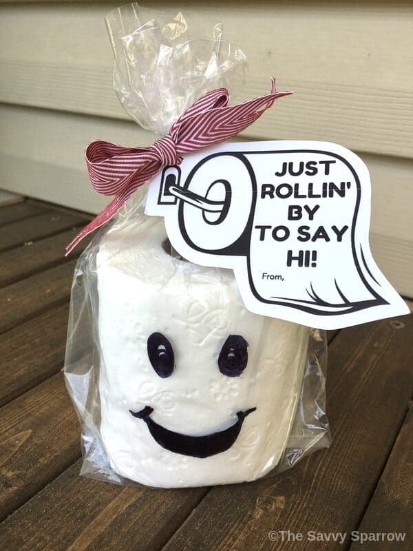 Toilet paper gift wrapped in cellophane bag with gift tag