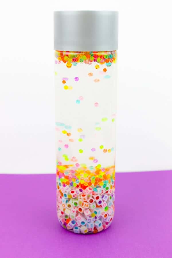 sensory bottle filled with colorful beads and water