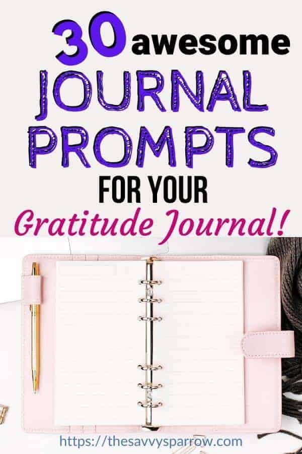 flat lay of open pink journal with the words "30 awesome journal prompts for your gratitude journal"