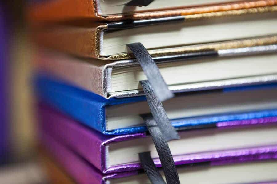 stack of brightly colored journals