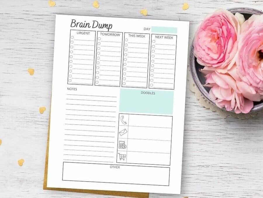 printable brain dump template on a table with pink flowers
