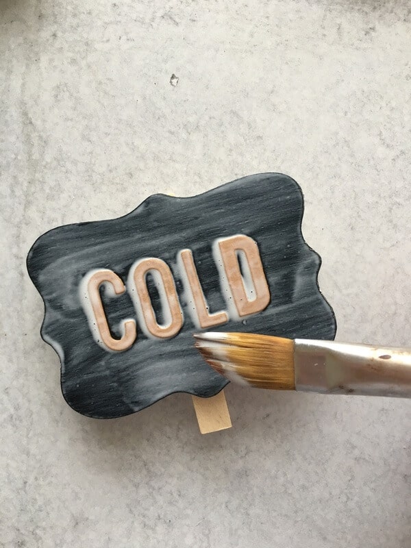 chalkboard label with the word cold on it and Mod Podge brushed on top