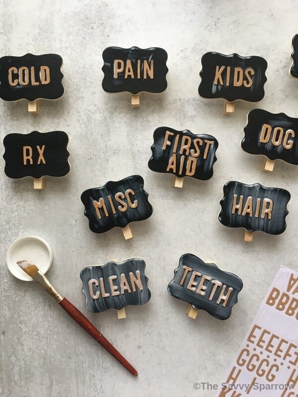 completed DIY basket labels drying on a table