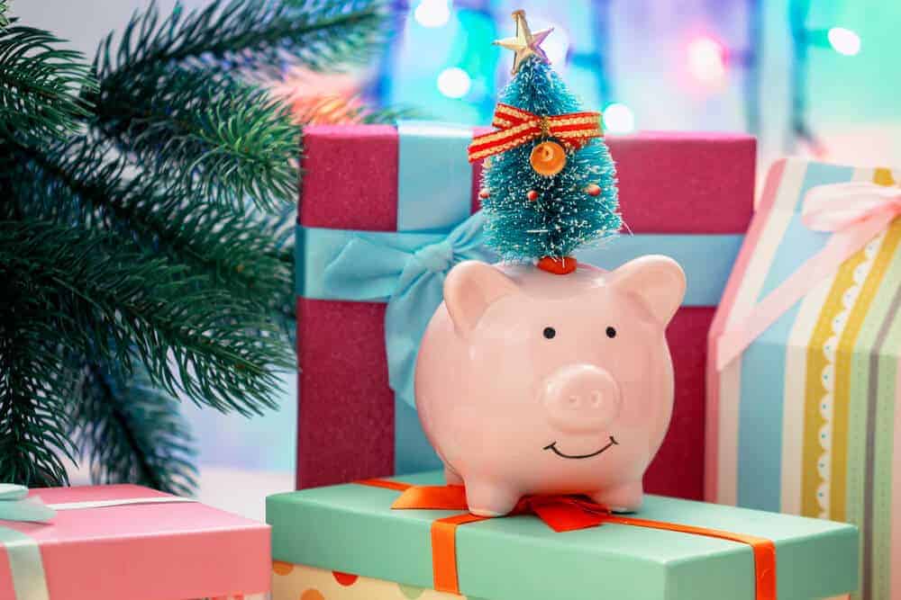 piggy bank on top of Christmas presents