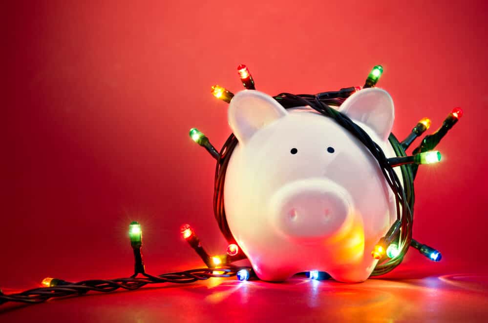 piggy bank wrapped with christmas lights