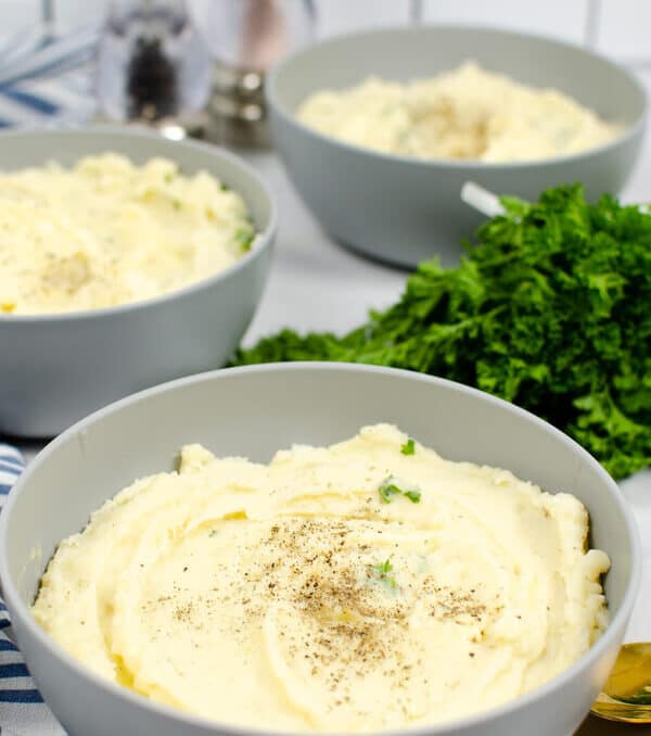 instant pot garlic mashed potatoes in a serving bowl