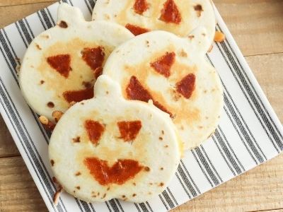 jack o lantern quesadillas on a plate