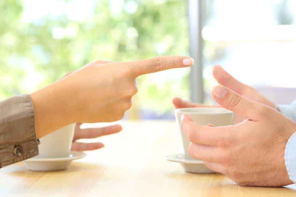 woman pointing a finger at a man