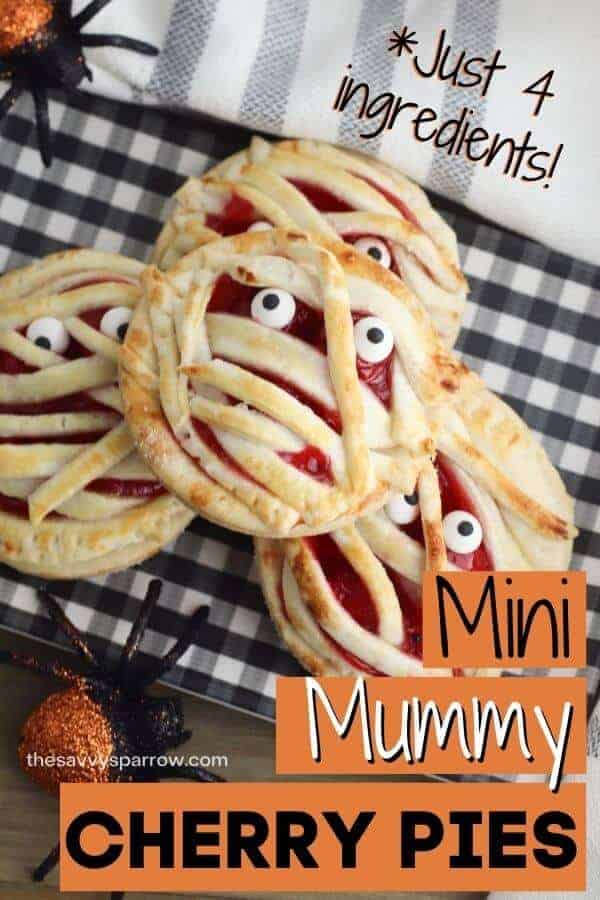 mini cherry pie mummy halloween treats stacked up on a plate
