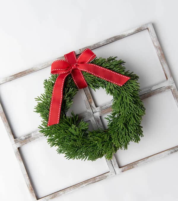 rustic farmhouse window decor with a Christmas wreath