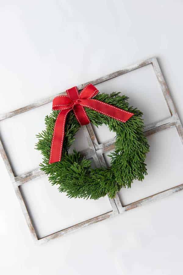 rustic farmhouse window decor with a Christmas wreath