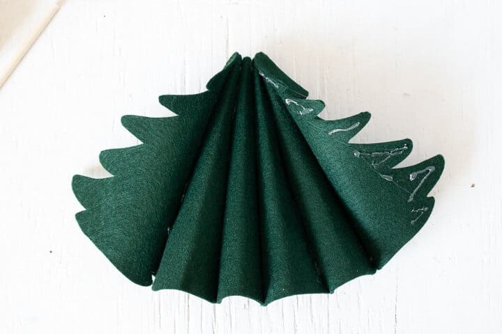 6 felt Christmas tree pieces glued together to form a 3D tree