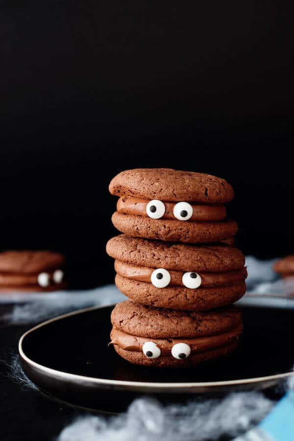 chocolate cookies with chocolate icing and candy eyeballs