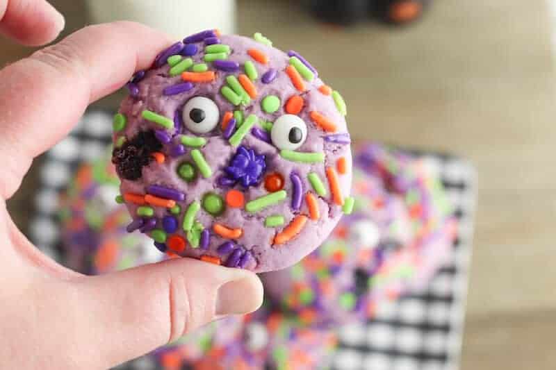 purple sugar cookies with sprinkles and eyeball candies