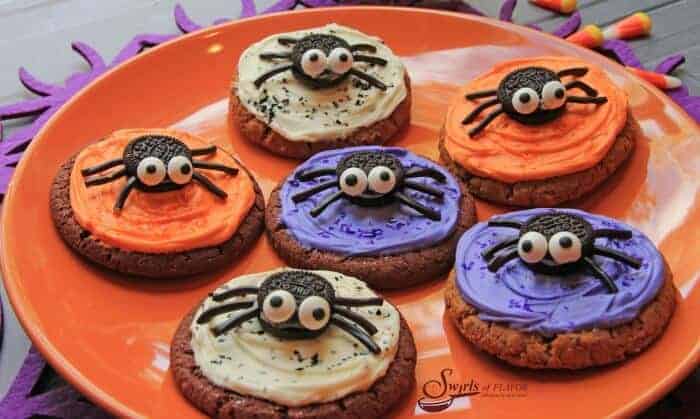 orange and purple Halloween cookies with spider decorations
