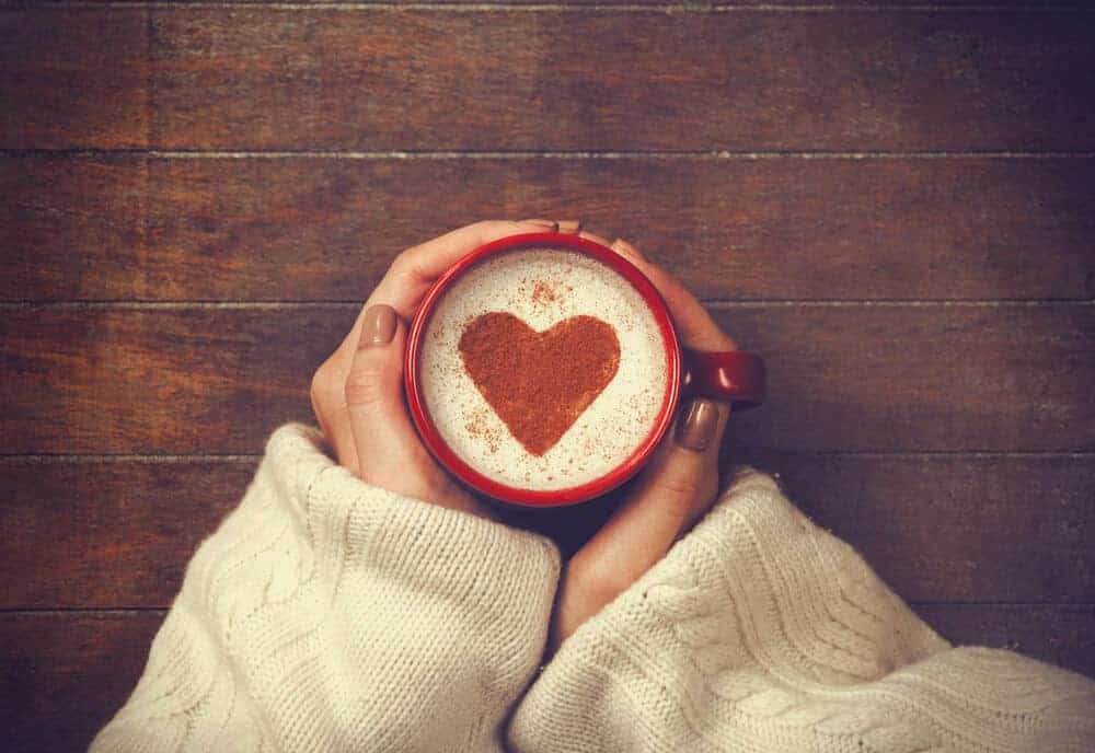 woman holding a coffee cup