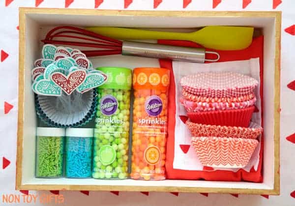 sprinkles, cupcake picks, cupcake lines, and spatulas in a gift box