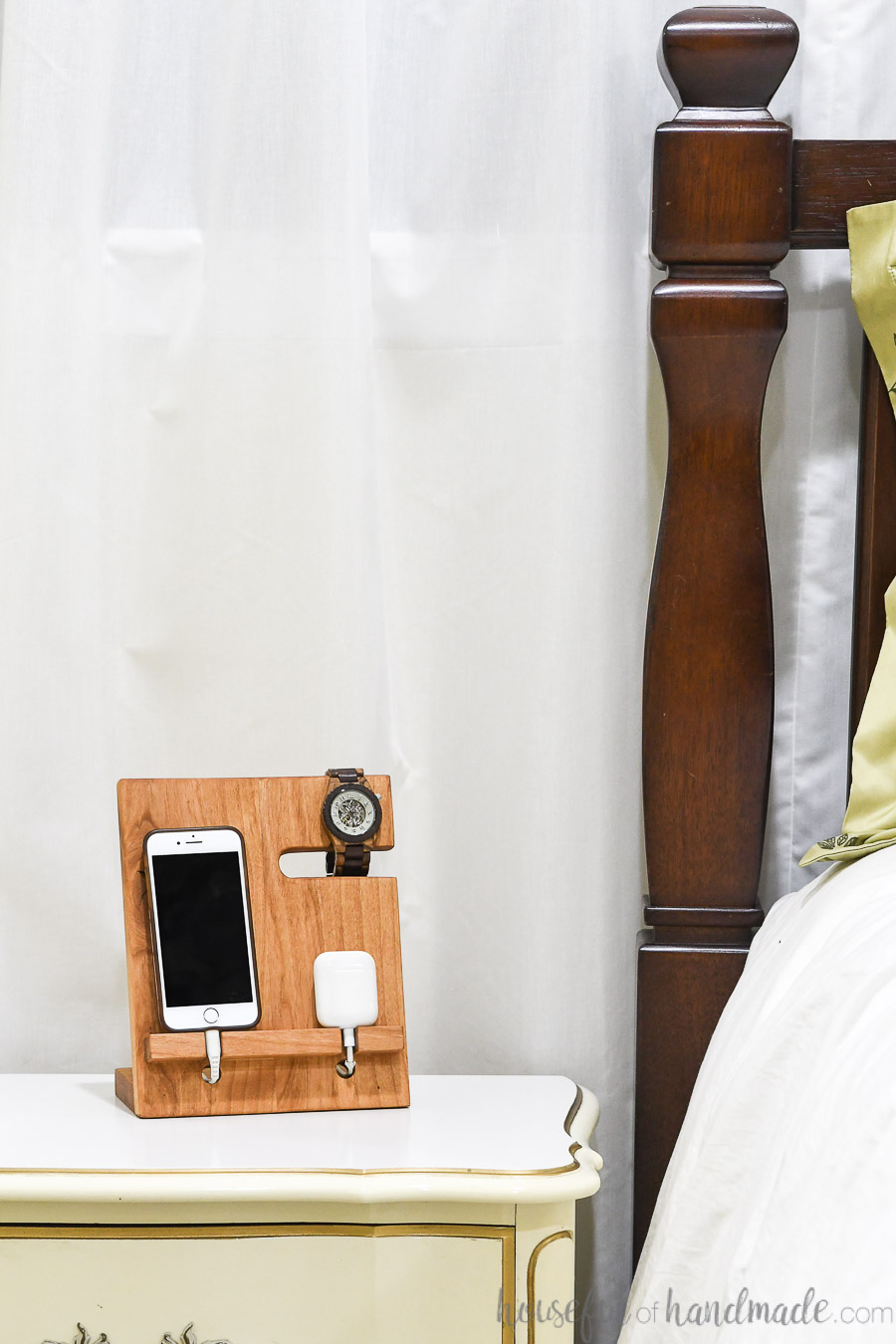 wood docking station on a nightstand