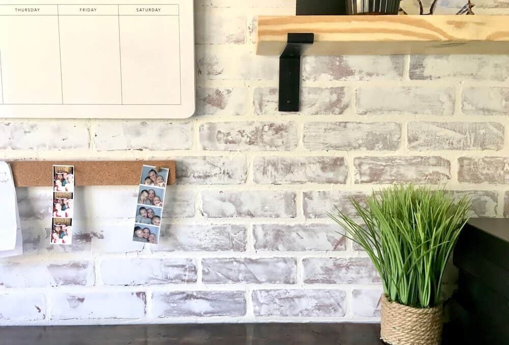 close up of a whitewashed brick wall in a home office