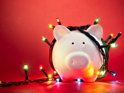 piggy bank with Christmas lights around it