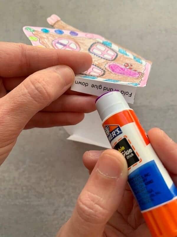 glue being applied to a piece of paper