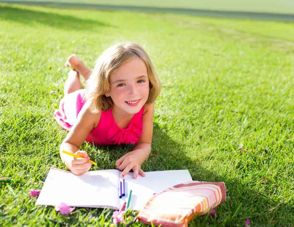 girl writing in a journal