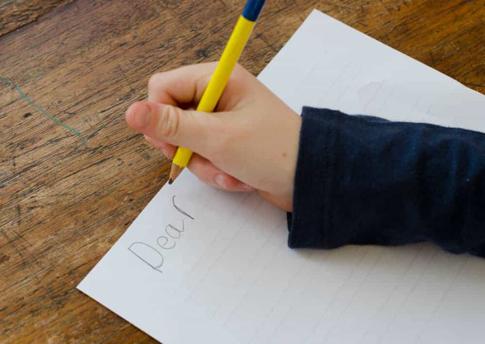 child writing a letter