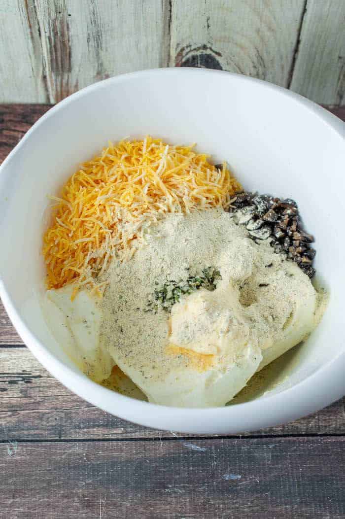ingredients for olive cheeseball in a bowl
