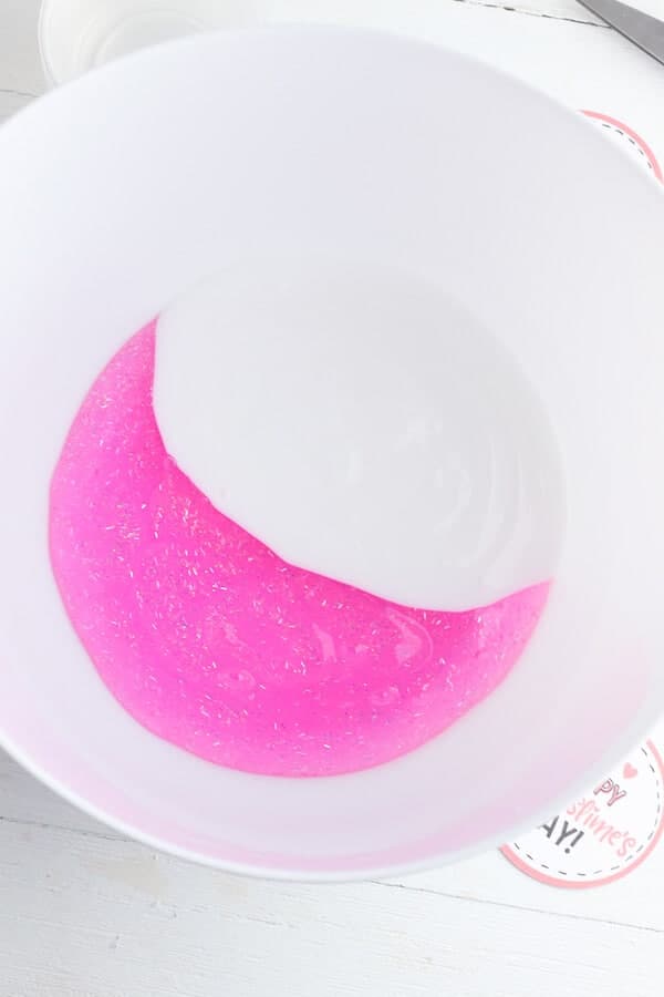 pink glitter glue and white glue in a bowl