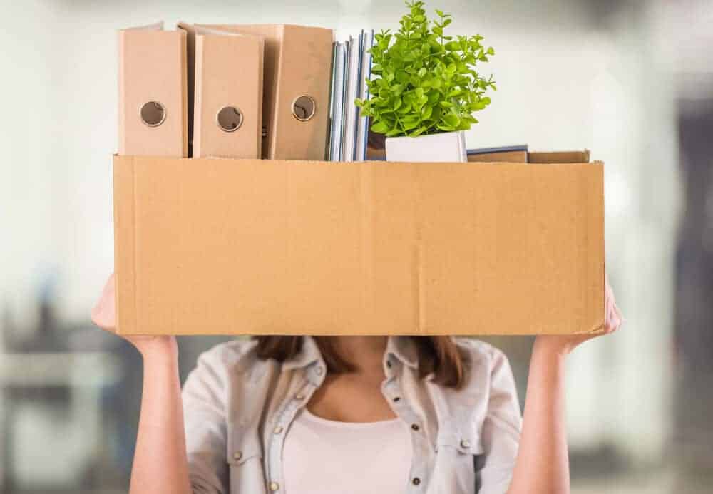 woman holding a box of clutter